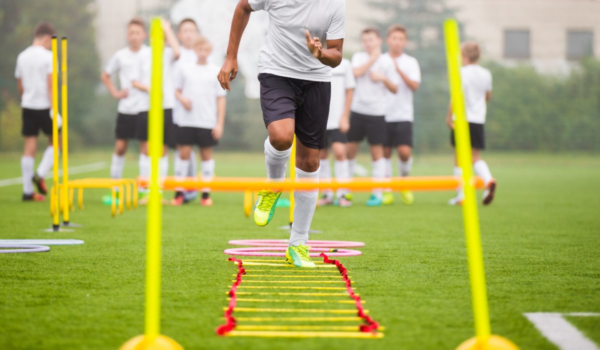 Boy Soccer Player In Training. Young Soccer Players at Practice Session