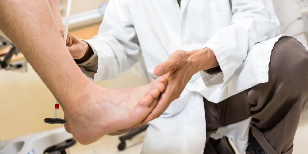 Doctor Examining Patient's Foot